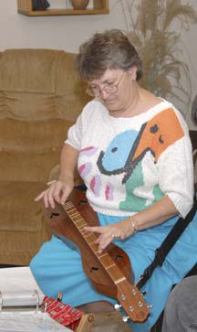 Rebecca playing dulcimer