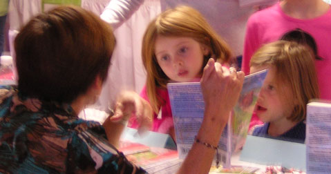 Marie with rapt young girl